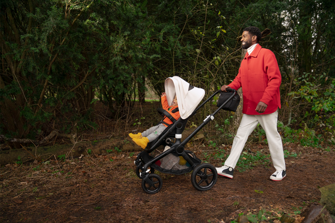Dad with baby in an all-terrain stroller
